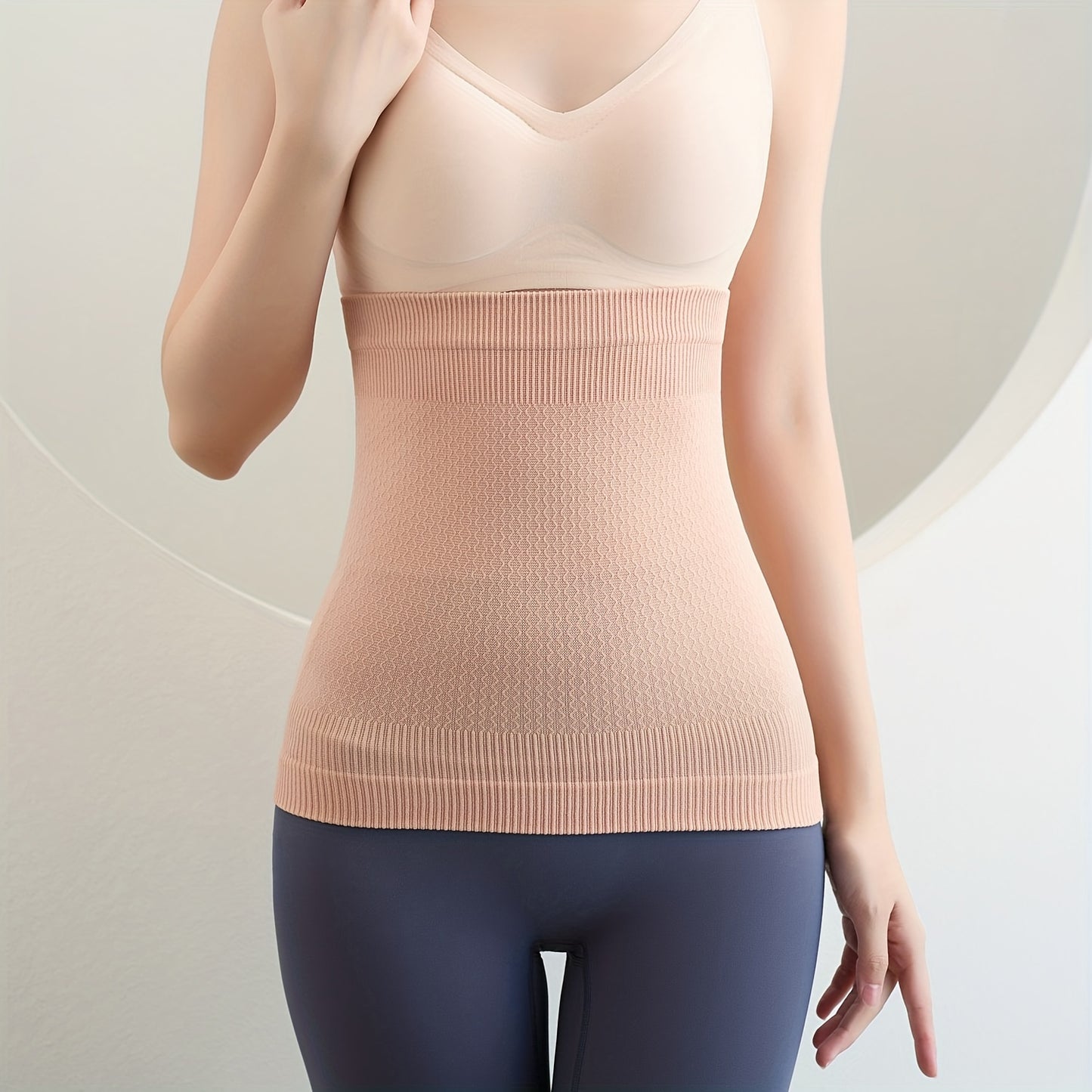 Seamless waist trainer for women, shapes and controls tummy.