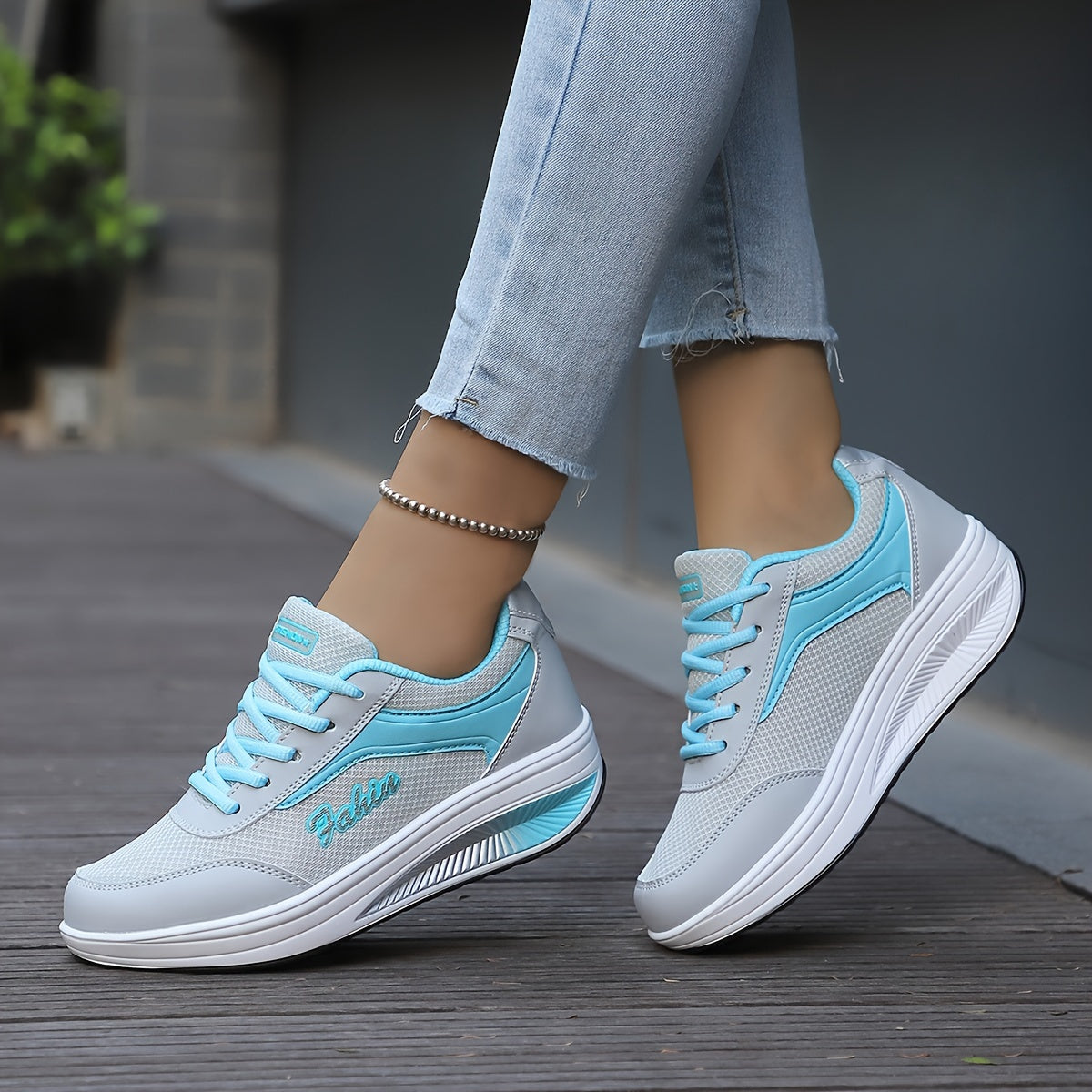 Women's platform sneakers with breathable mesh, lace-up design, and comfortable fit in plus size