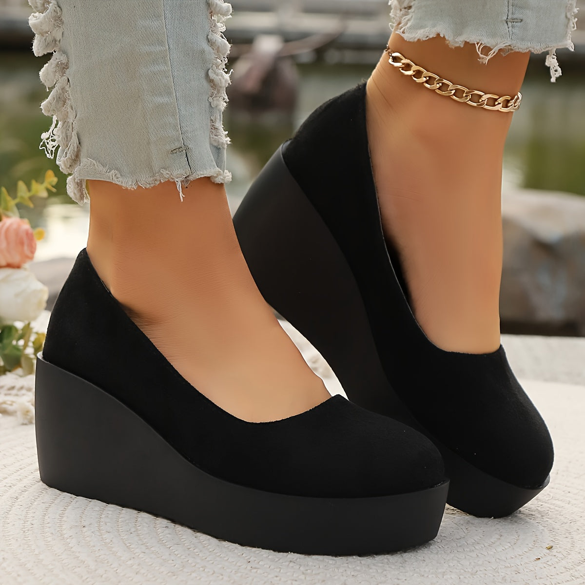 Women's stylish black slip-on platform wedge loafers for casual daily wear.