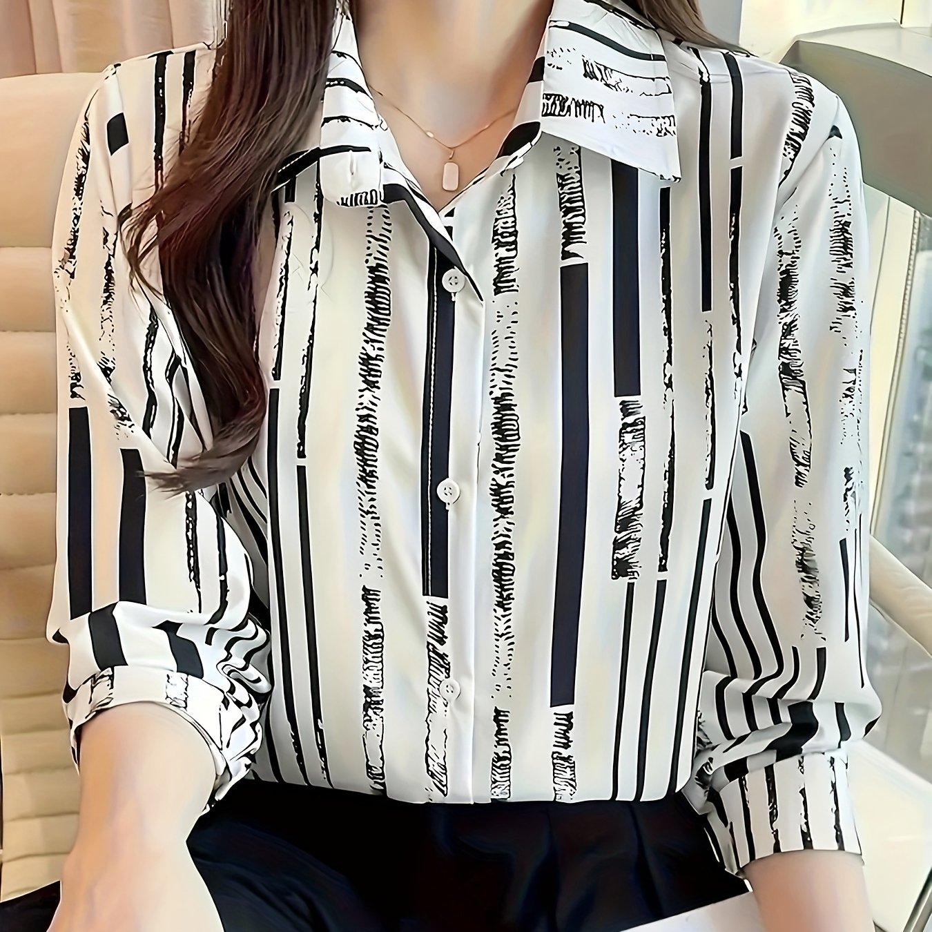 Casual striped print button-down shirt for women. Made from 100% polyester woven fabric with a lapel collar, long sleeves, and lightweight at 110g/m². Ideal for spring, summer, or fall.