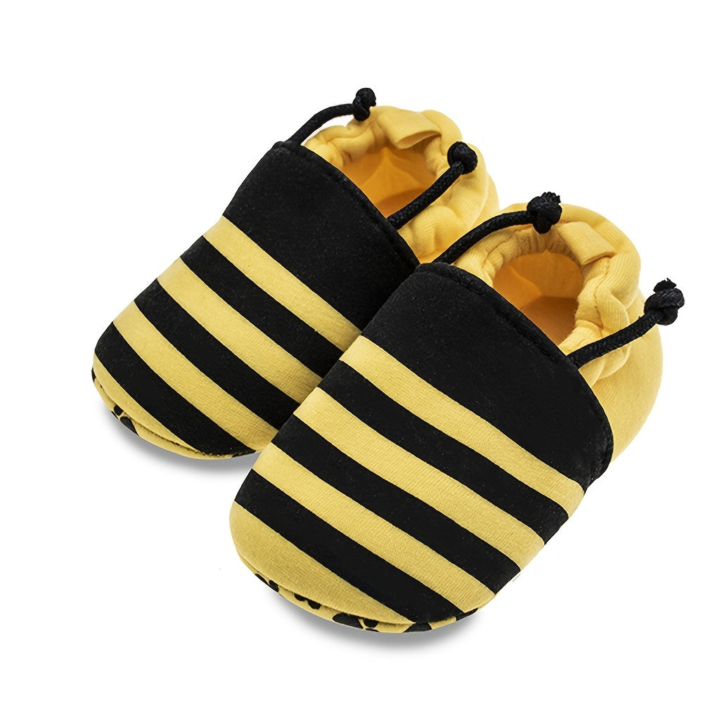 Baby slip-on walking shoes with cute bee cartoon design, fabric upper, cloth insole, and fabric sole suitable for all seasons.