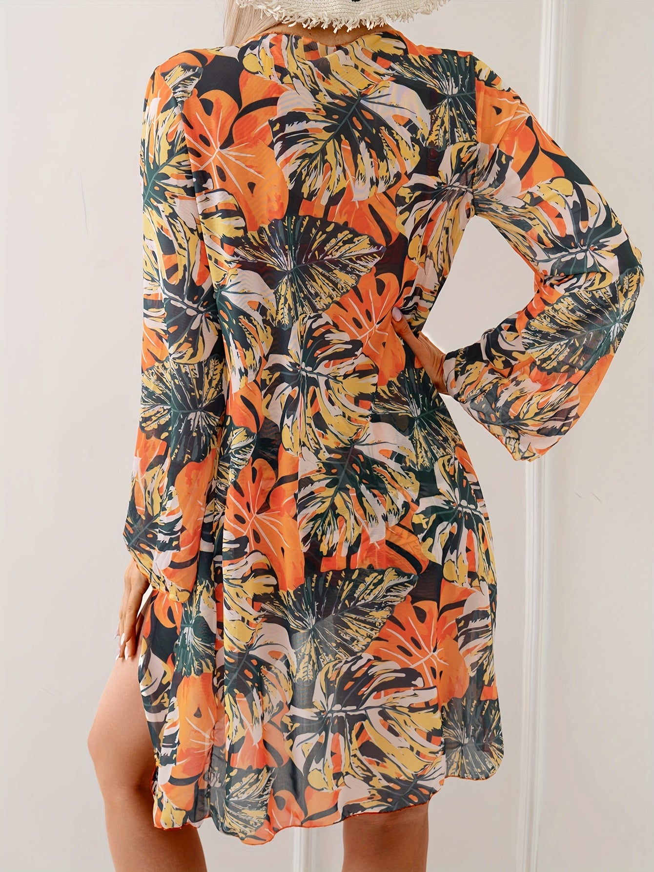 Vibrant summer beachwear set includes tropical print swimsuit with long sleeve kimono cover-up, high-waisted bottoms, and spaghetti strap top made of polyester blend.