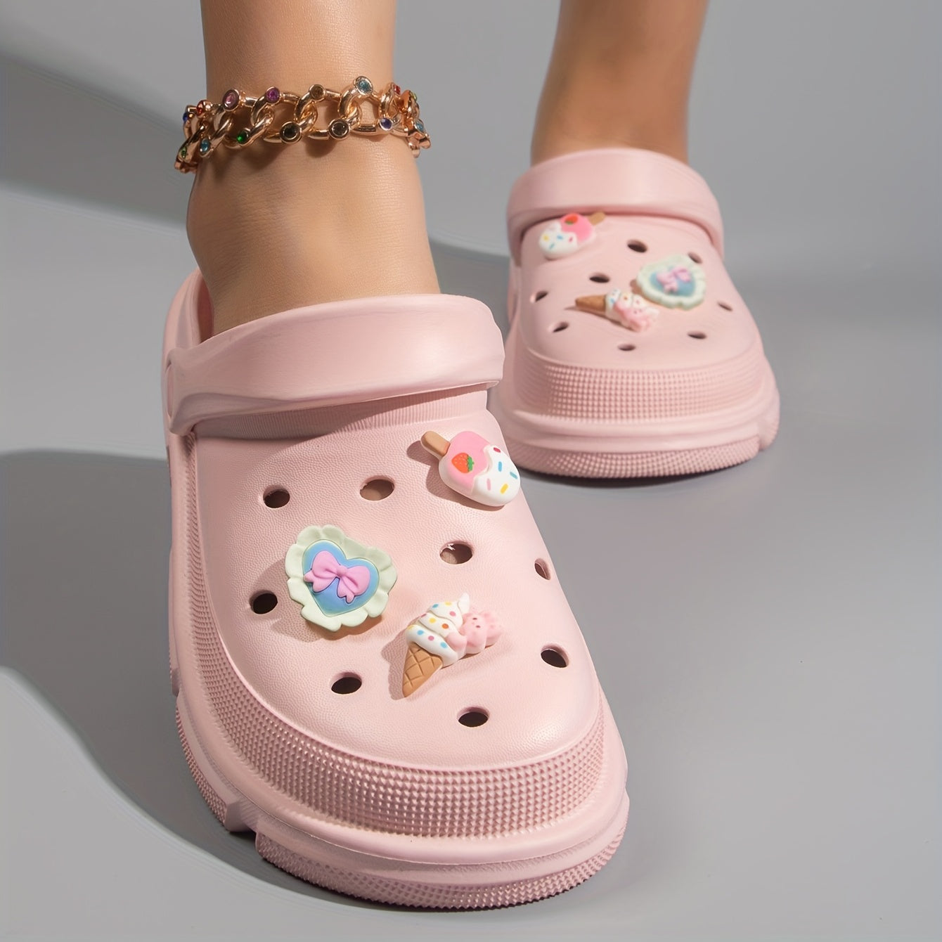 Women's cute cartoon clogs with round toe and breathable design for comfortable wear.