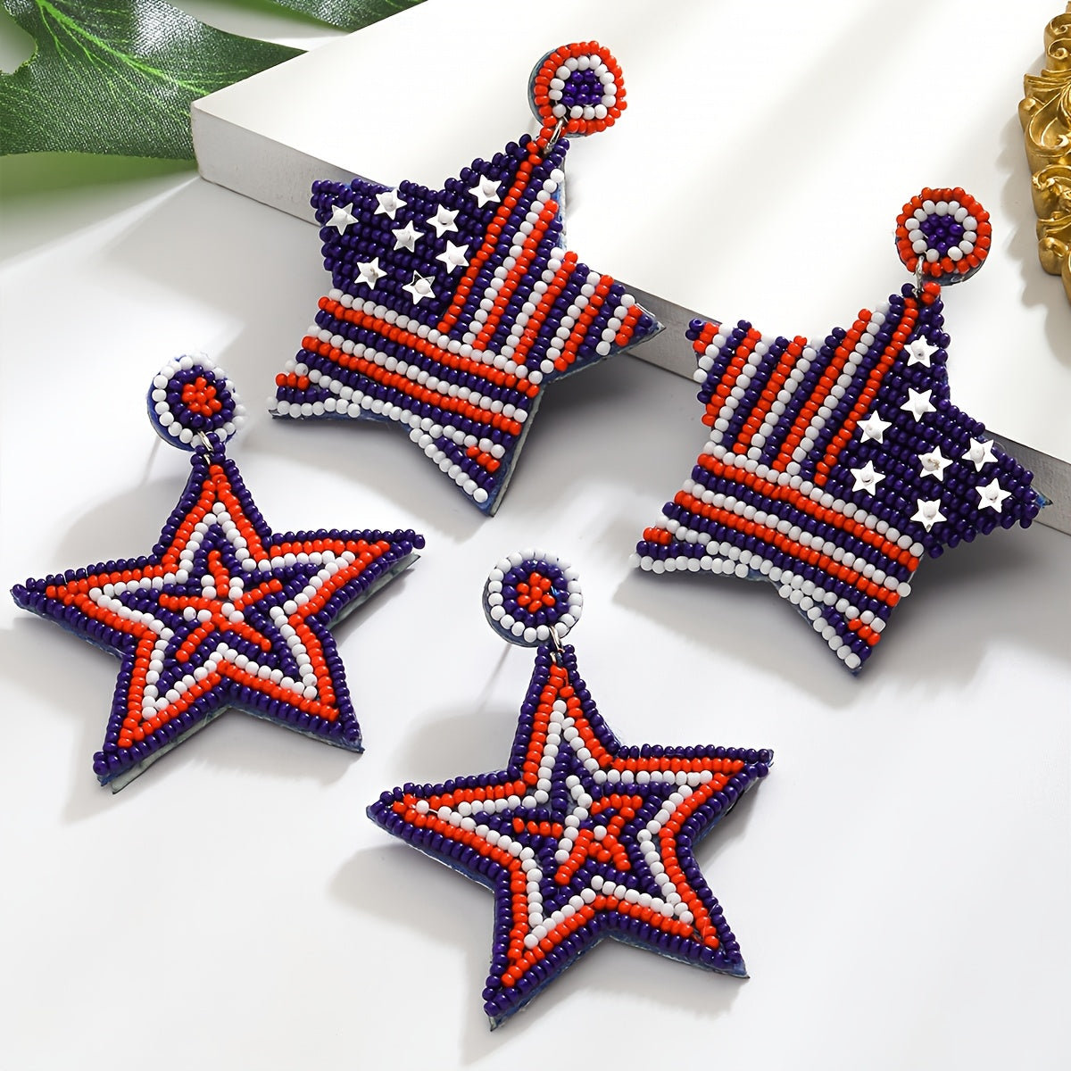 Handcrafted American flag beaded earrings with a boho chic vibe, featuring celestial symbols and a cute style. Made with stainless steel posts, these earrings are perfect for daily wear or festivals all year round. Feather-free design.