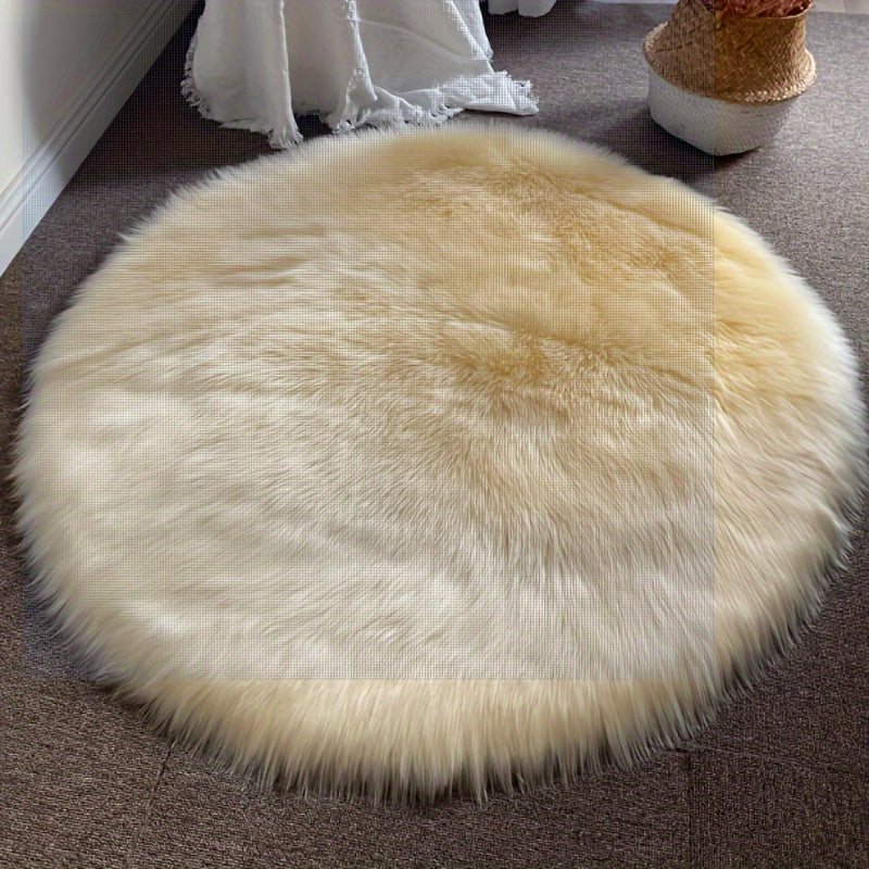 Round luxury area rug made from soft faux fur material with high pile and knit weave, machine washable, lightweight and fluffy. Crafted from a blend of polyester and acrylic in a solid color design. Perfect for adding a cozy touch to bedroom, living