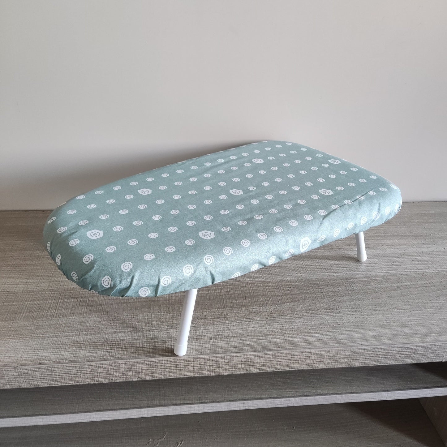 Compact Floral Design Ironing Board, Foldable Tabletop Clothes Pressing Pad, Sturdy Plastic Material, Secure Base, Convenient Space-Saving Option