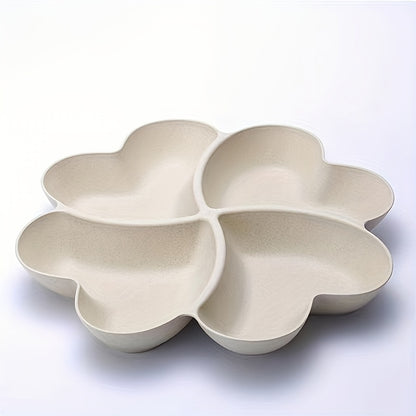 Heart-shaped party snack tray with 4 compartments, perfect for serving nuts, candy, fruit, and other snacks. Made of reusable plastic in blue, green, beige, and pink colors.