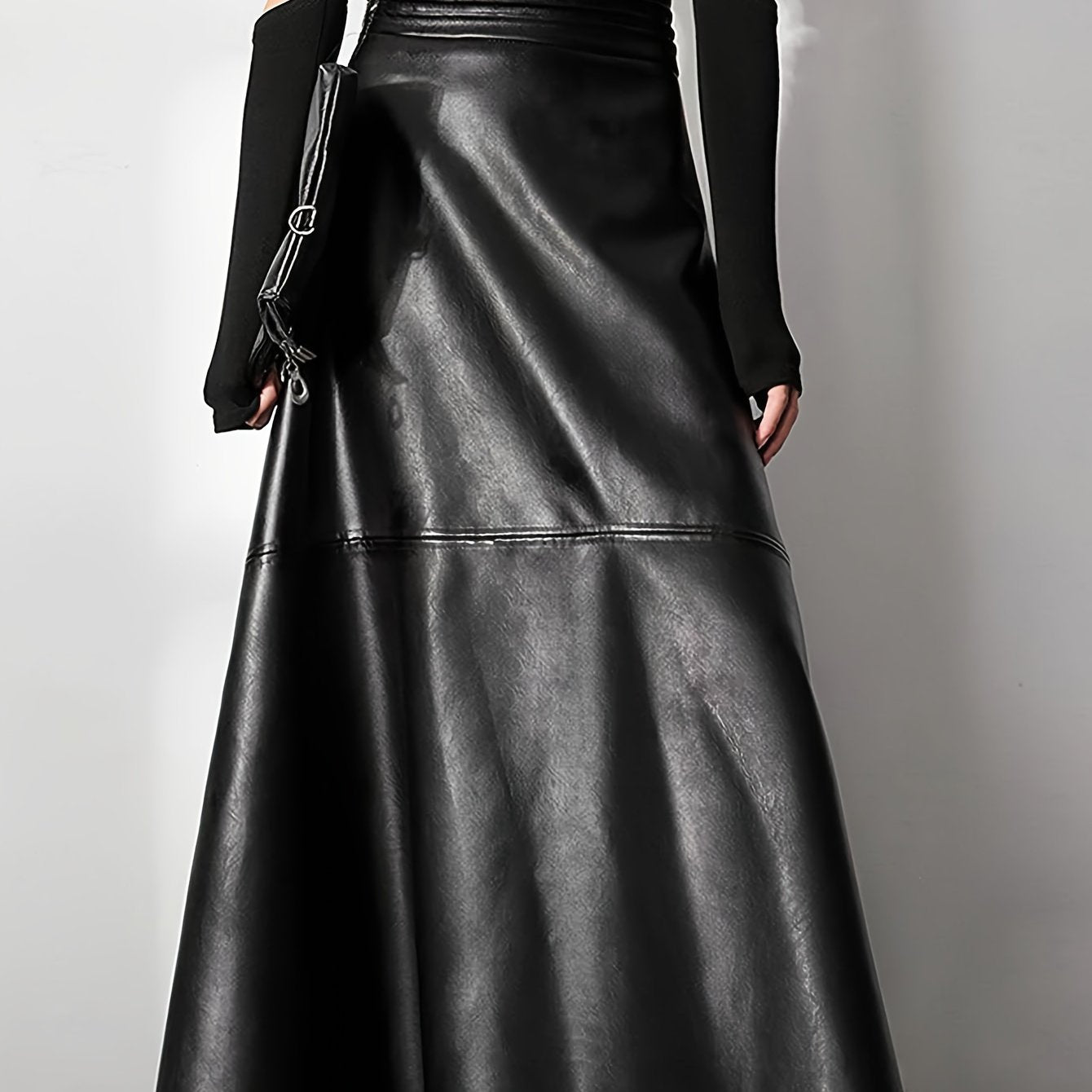 Plus-size fashionable women's flared A-line faux leather skirt with custom design.