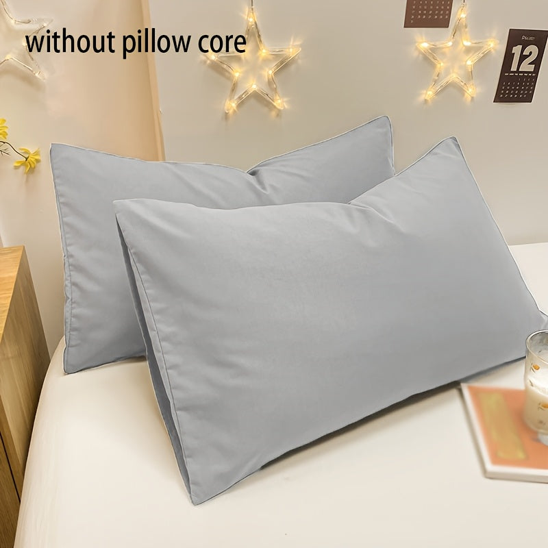 Basic set of 2 rectangular pillowcases made of 90g solid color fleece material, featuring an envelope closure design. These pillowcases are ultra soft, breathable, and machine washable, suitable for use in bedrooms, guest rooms, hotels, and more. The