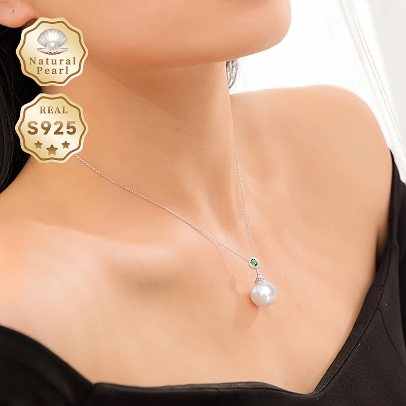 Give your loved one a special treat with this must-have gift box containing a stunning S925 silver pendant necklace featuring a 13-14mm round natural freshwater pearl. Each necklace is unique, with variations in natural pearls, shapes, and colors. The