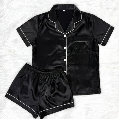 Casual satin pajama set for women with short sleeve top, lapel buttons, and shorts for a comfortable fit.