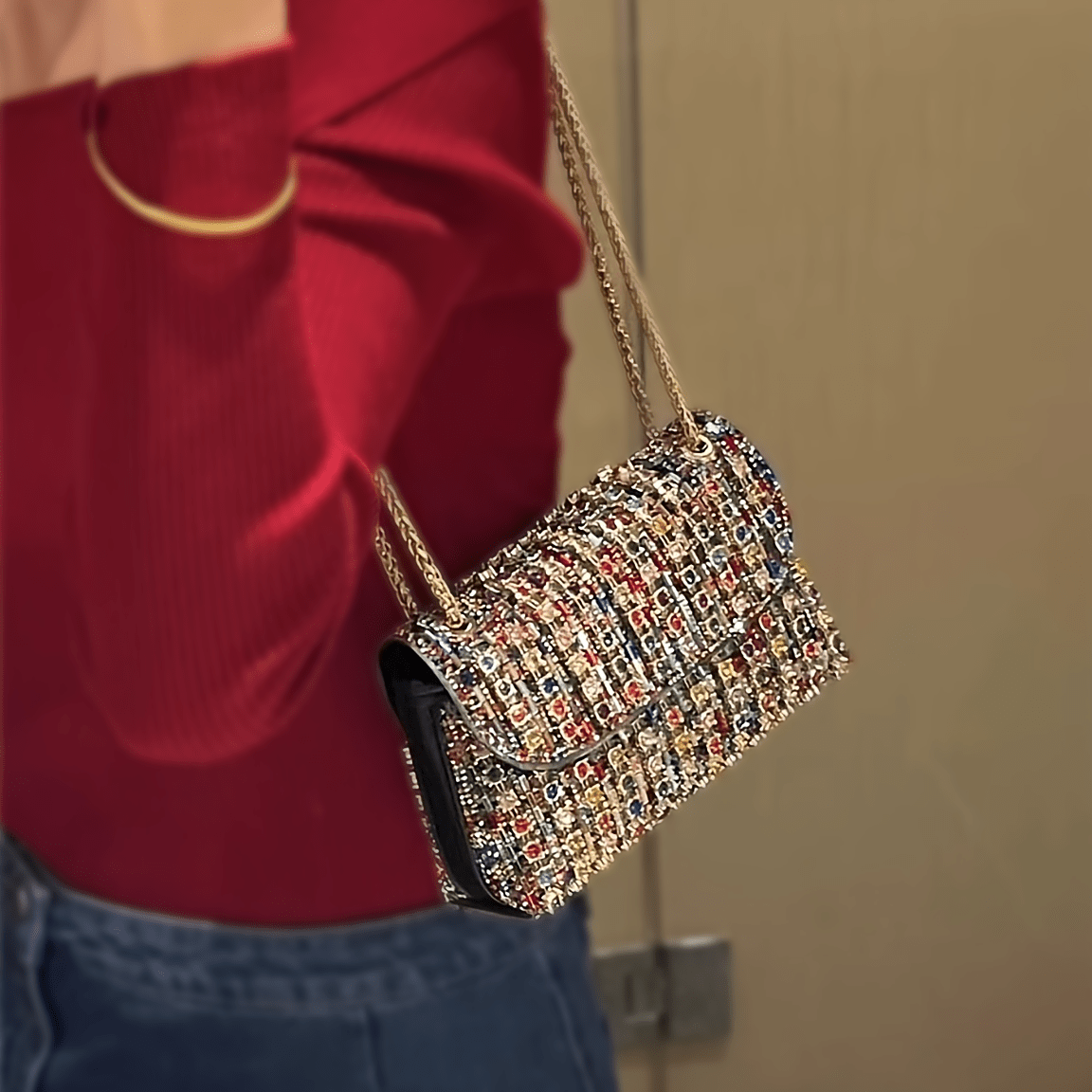 Stylish women's evening clutch with rhinestones and beads, adjustable strap, and magnetic closure, perfect for formal events.