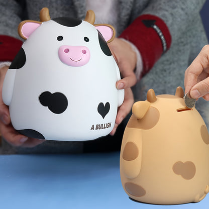 Cute cow-shaped penny bank, perfect for saving money and as a creative gift for birthdays and Christmas. Made of non-waterproof PVC with latch closure, ideal for desk decor.