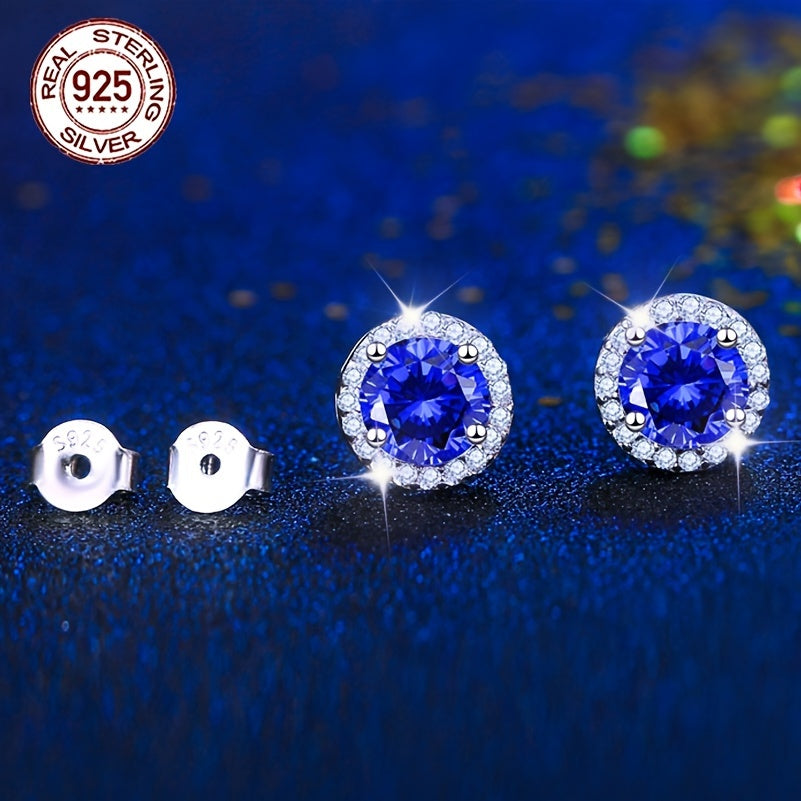 A beautiful pair of royal blue Tanzanite stud earrings in an elegant vintage style. Made from 925 sterling silver and featuring synthetic stones, these earrings are hypoallergenic and perfect for special occasions like weddings, gifting, Valentine's Day