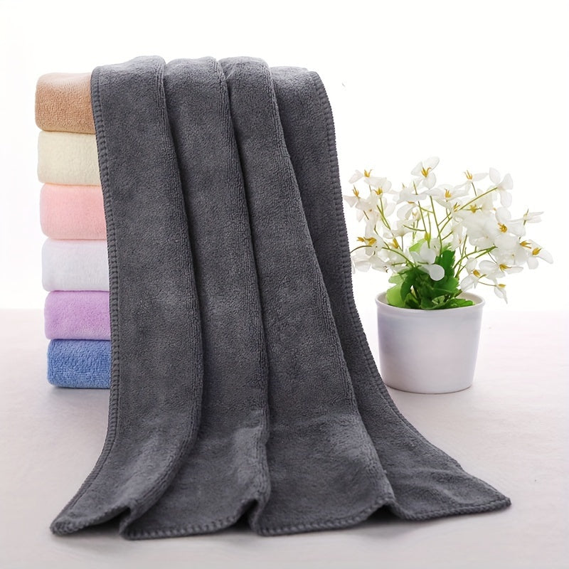 Soft microfiber bath towel with quick dry and absorbent features for use at home or in the spa, featuring a modern cloud pattern design.