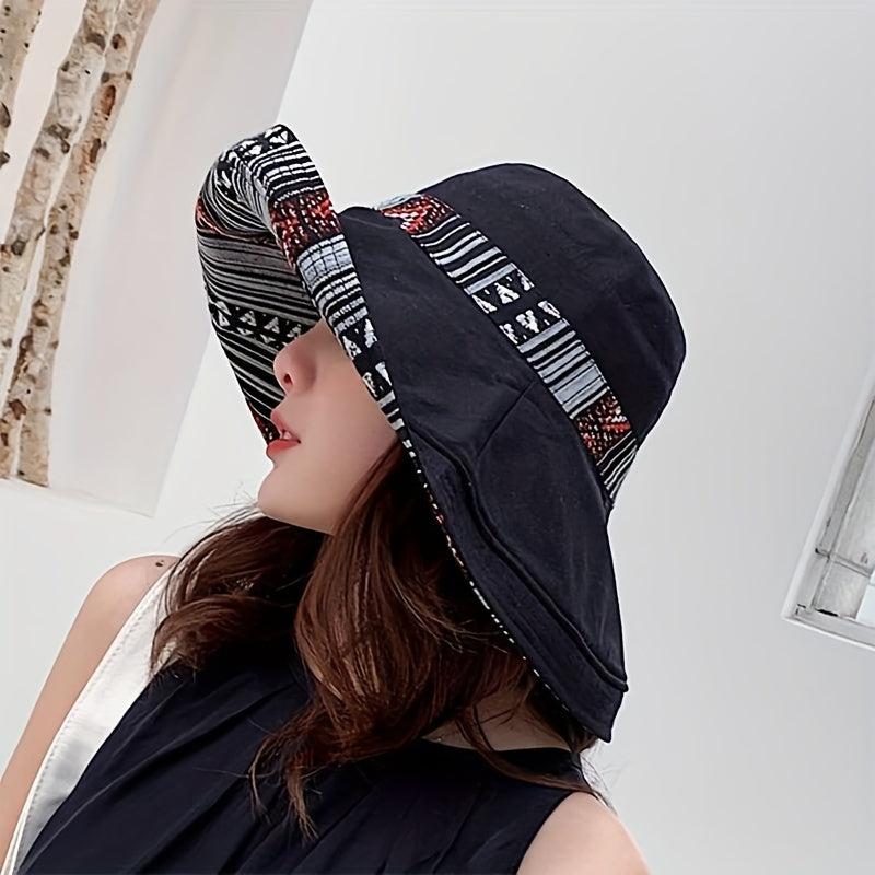 Reversible wide brim cotton bucket hat for women in dark blue with geometric pattern and multicolor accents. Great for travel and outdoor activities. Provides UV protection and