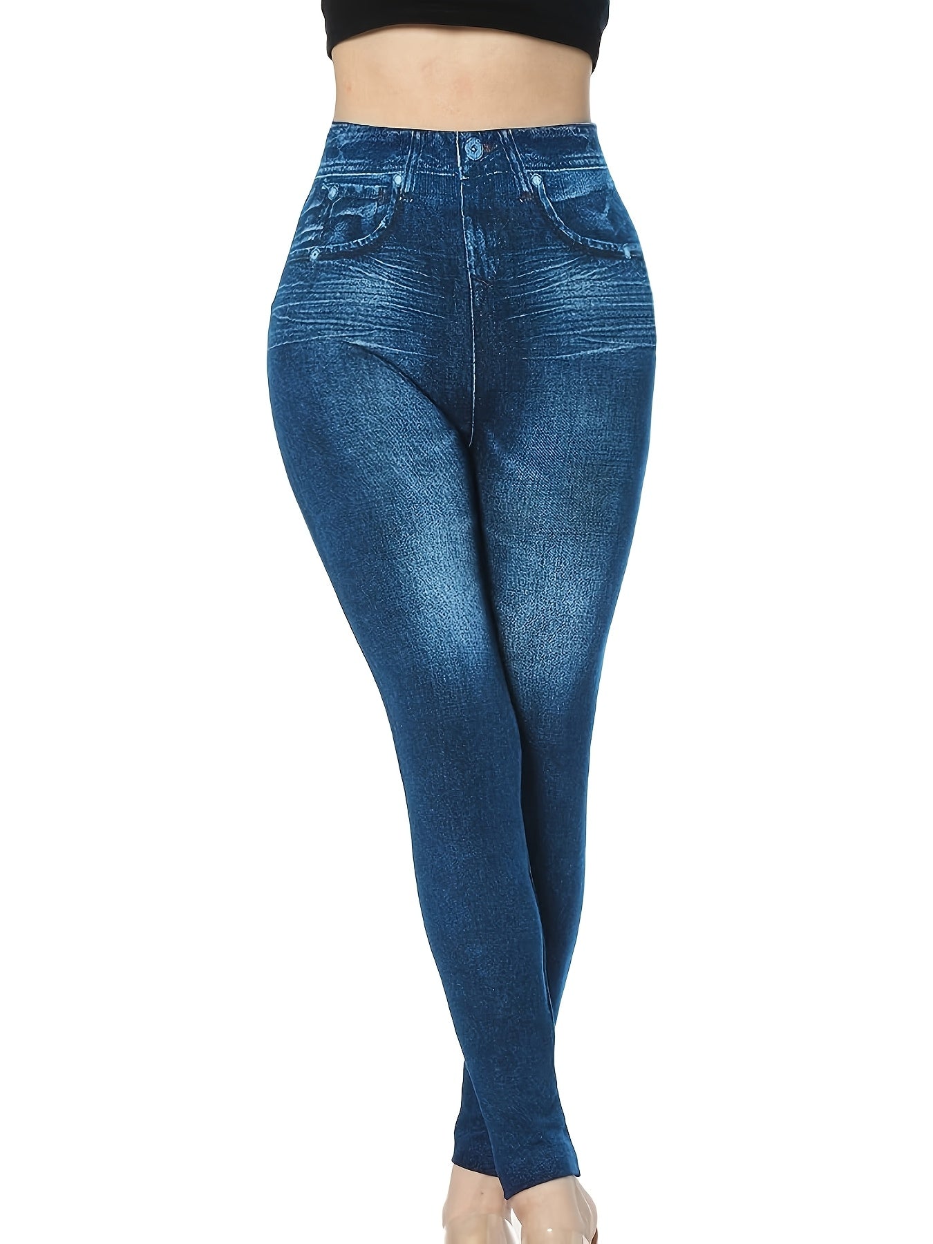 Stretch denim-look leggings for plus size women with high elasticity, faux pockets, and smooth fabric. Perfect for vacations and everyday wear.