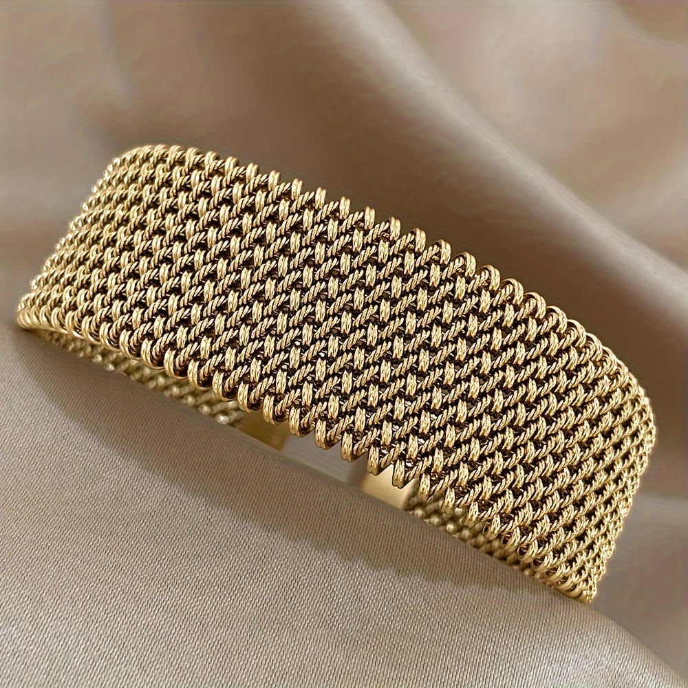 Stylish woven stainless steel bracelet with a golden touch, versatile accessory in trendy golden tone.