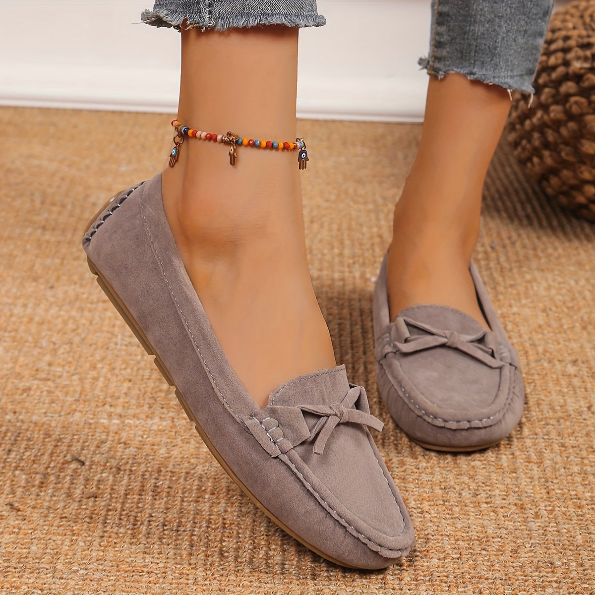 Retro flat loafers with bow detail, slip on style, and soft sole for casual wear.