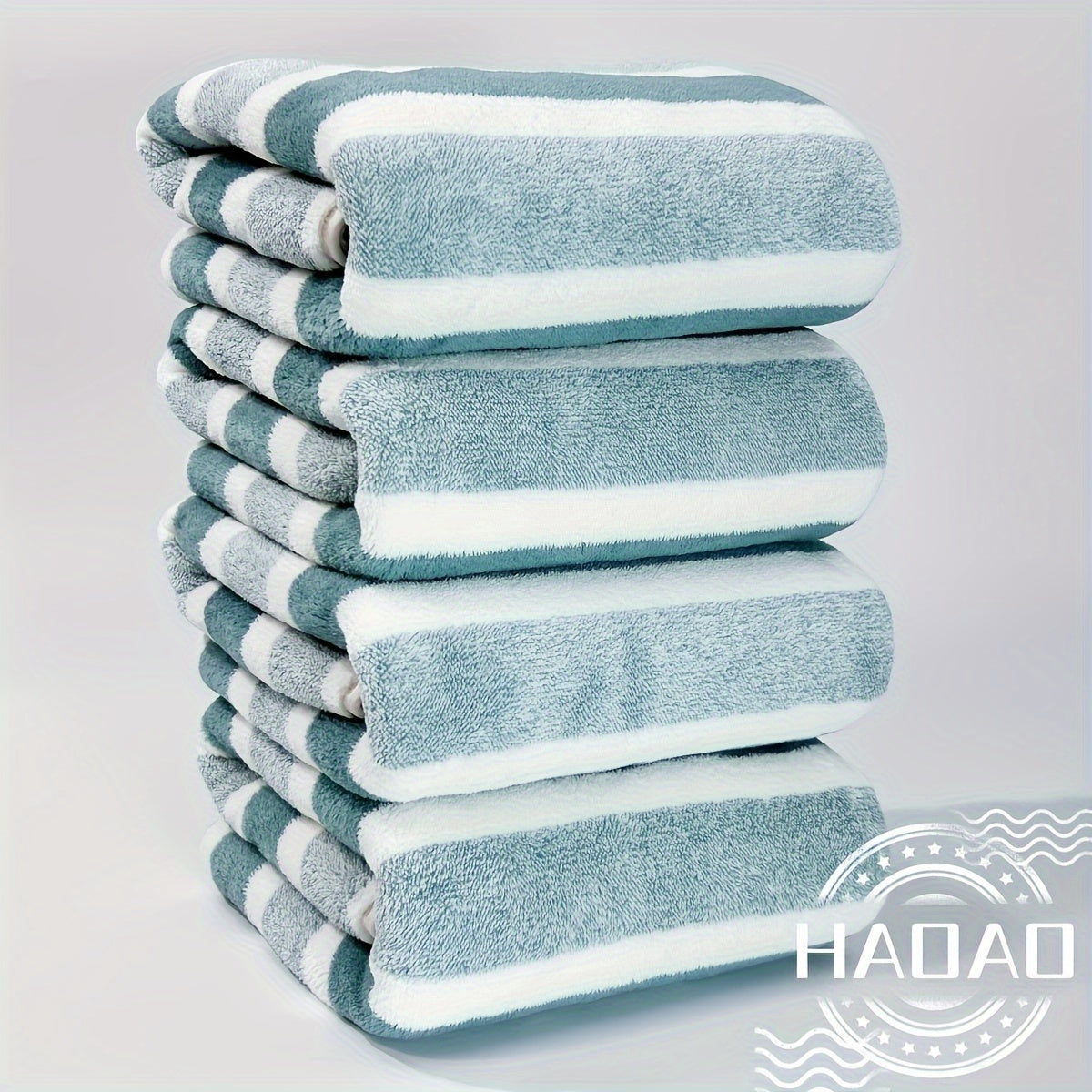 Modern 4-piece coral fleece towel set with geometric pattern, made of 100% polyester for softness and quick-drying absorbency. Ideal space-themed bathroom essential.