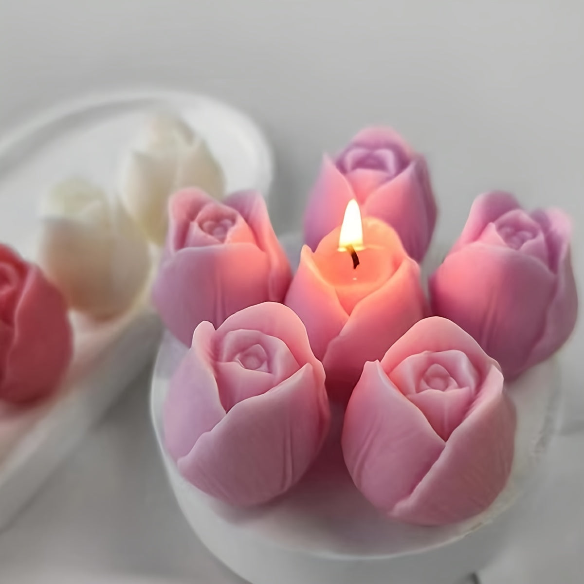 Pink tulip-shaped silicone mold for DIY candle and resin crafts, with flexible, irregular flower design for decorative ornaments.