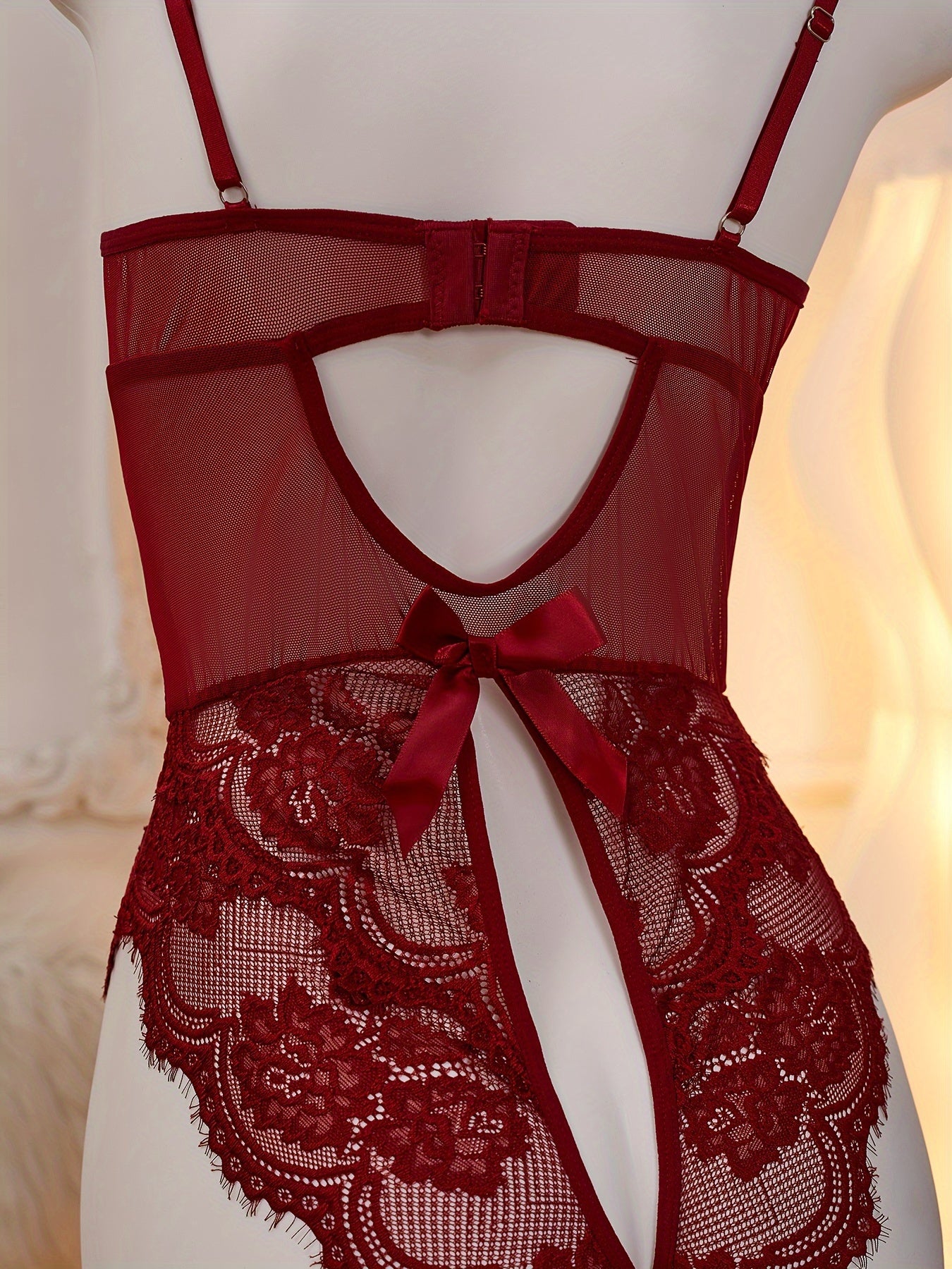 Red lace velvet teddy with heart cut-out, open crotch, and strappy back for women's lingerie.