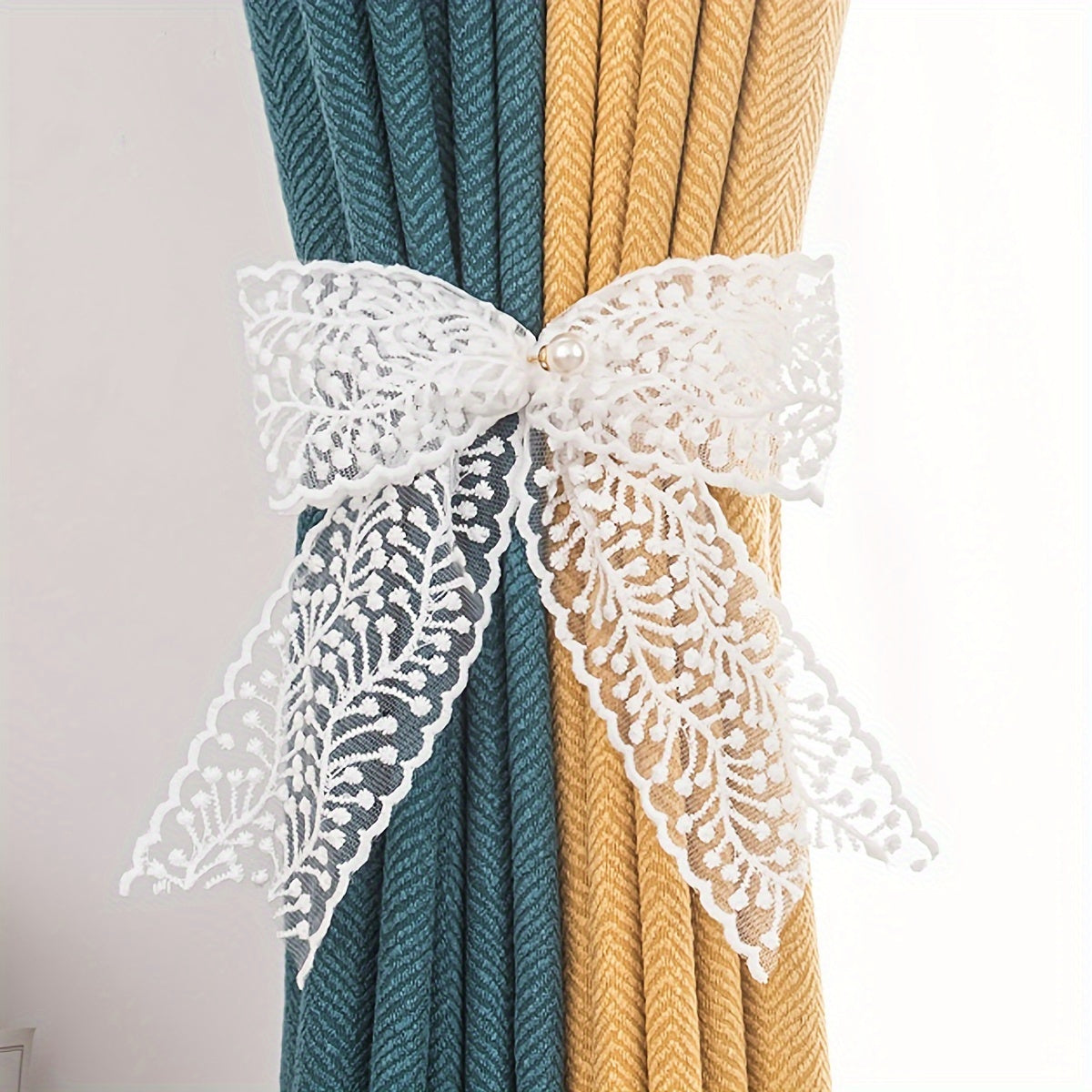 1 Pair of Bow Lace Pearl Curtain Tiebacks - A chic and versatile way to add a touch of elegance to your curtains. These French lace pearl ribbon tiebacks are perfect for use in the bedroom, living room, study, coffee shop, or any other room in your home