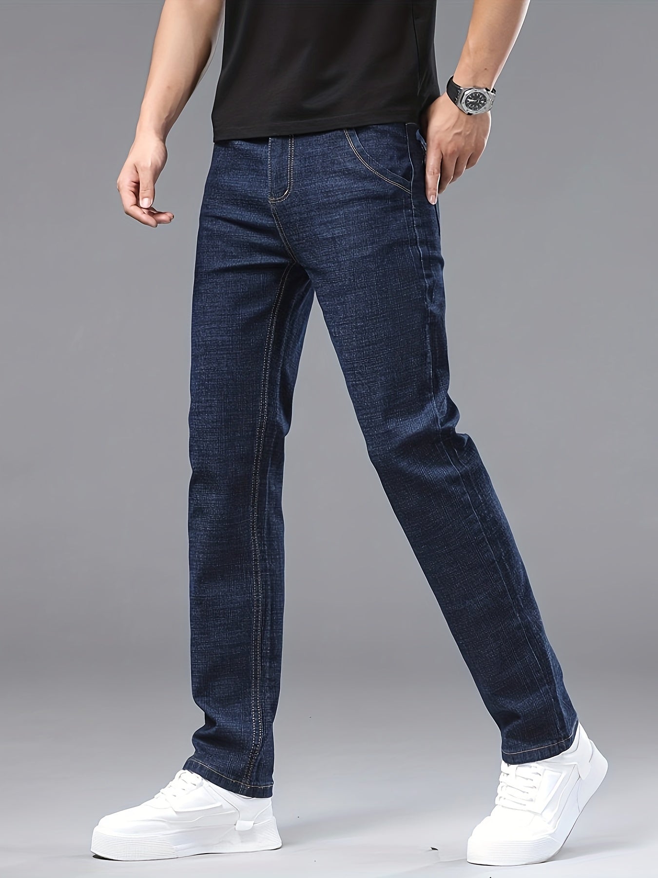 Men's slim-fit jeans made of 61.6% cotton, 36.9% polyester, and 1.5% spandex with all-season stretch denim. Raw wash in a solid color, regular fit for casual weekends. 200gsm woven fabric.