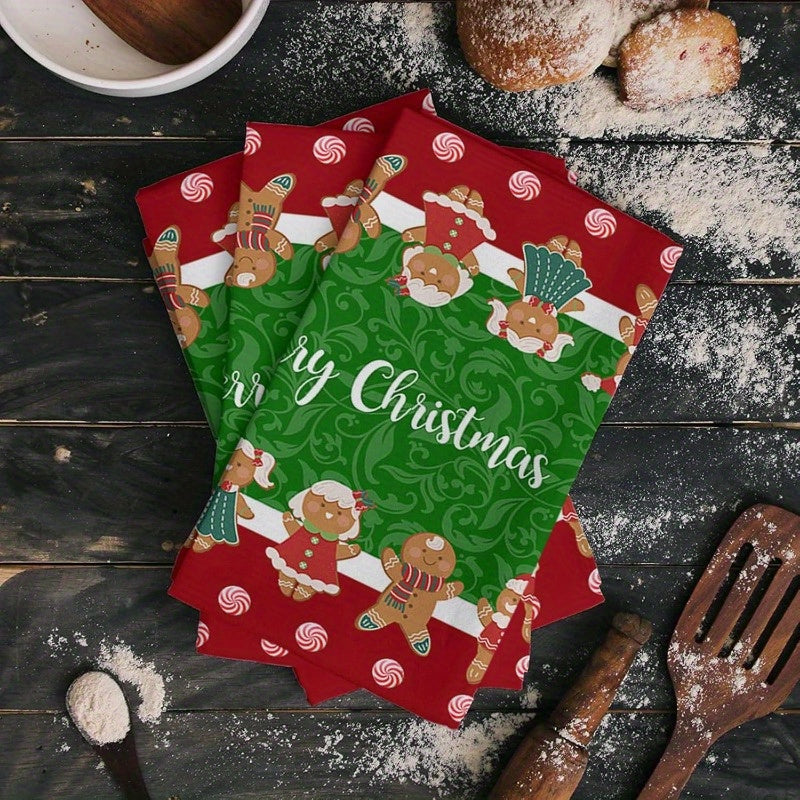 A set of 2 kitchen towels measuring 45.72 x 66.04 cm each, featuring a festive Christmas party decoration design. These towels are reusable and perfect for holiday gift-giving. The design includes Merry Christmas text, gingerbread men, and candy cane