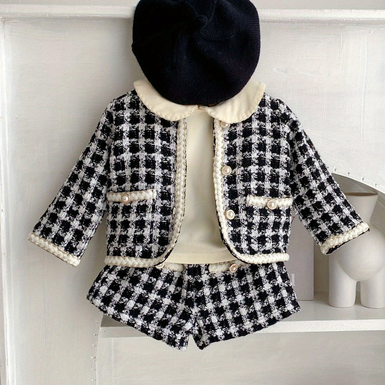 Stylish two-piece outfit with checkered shirt jacket and shorts, ideal for spring and autumn children's parties outdoor.