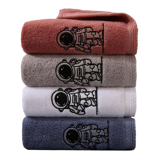 Embroidered astronaut pattern velvet towel, 100% cotton, absorbent, vibrant colors, perfect for bathroom or kitchen decor.