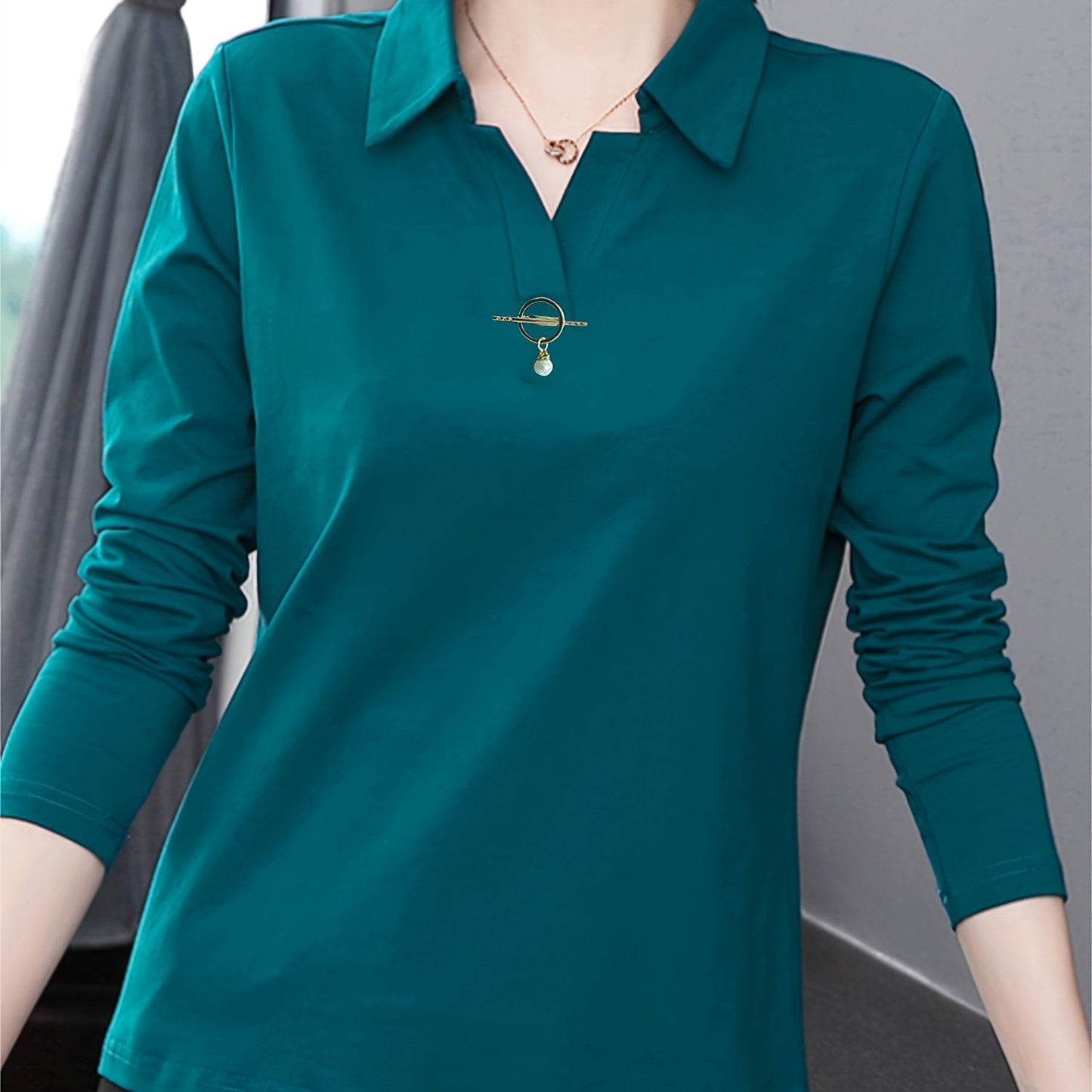 Solid color collared T-shirt for women, good for spring and fall seasons.