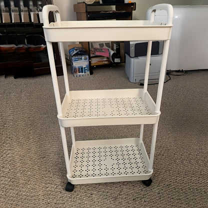 The White Plastic Multi-Layer Storage Cart is a versatile and practical solution for organizing your kitchen, bathroom, or bedroom. Ideal for multi-purpose storage and organization needs.