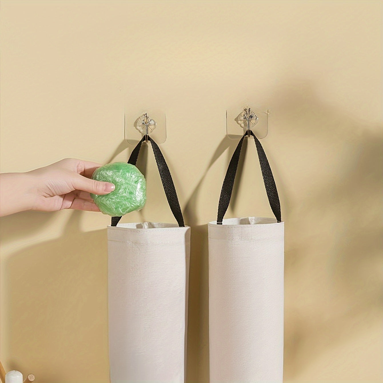 Organize your kitchen with our wall-mounted garbage bag holder - the perfect space-saving solution for keeping plastic bags and other items tidy and accessible.