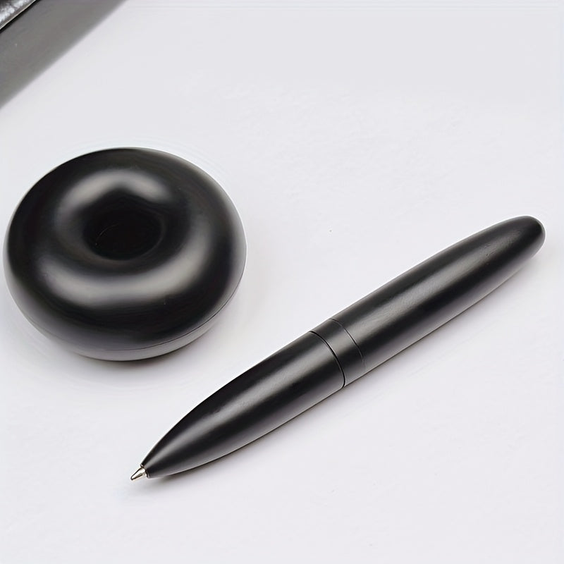 Magnetic levitation round ballpoint pen for men's gift with metal and plastic pen holder.