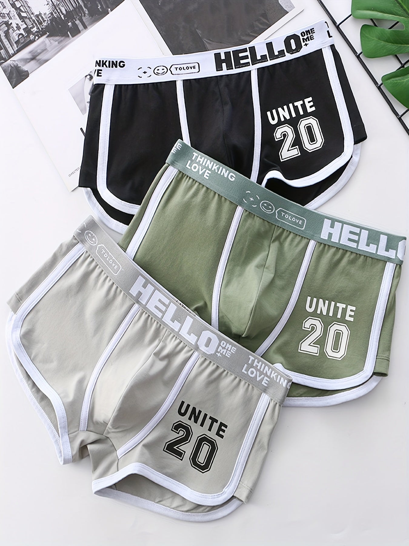 Men's set of 3 printed fashion cotton boxers in green, gray, and black. Comfortable, breathable, and quick-drying.