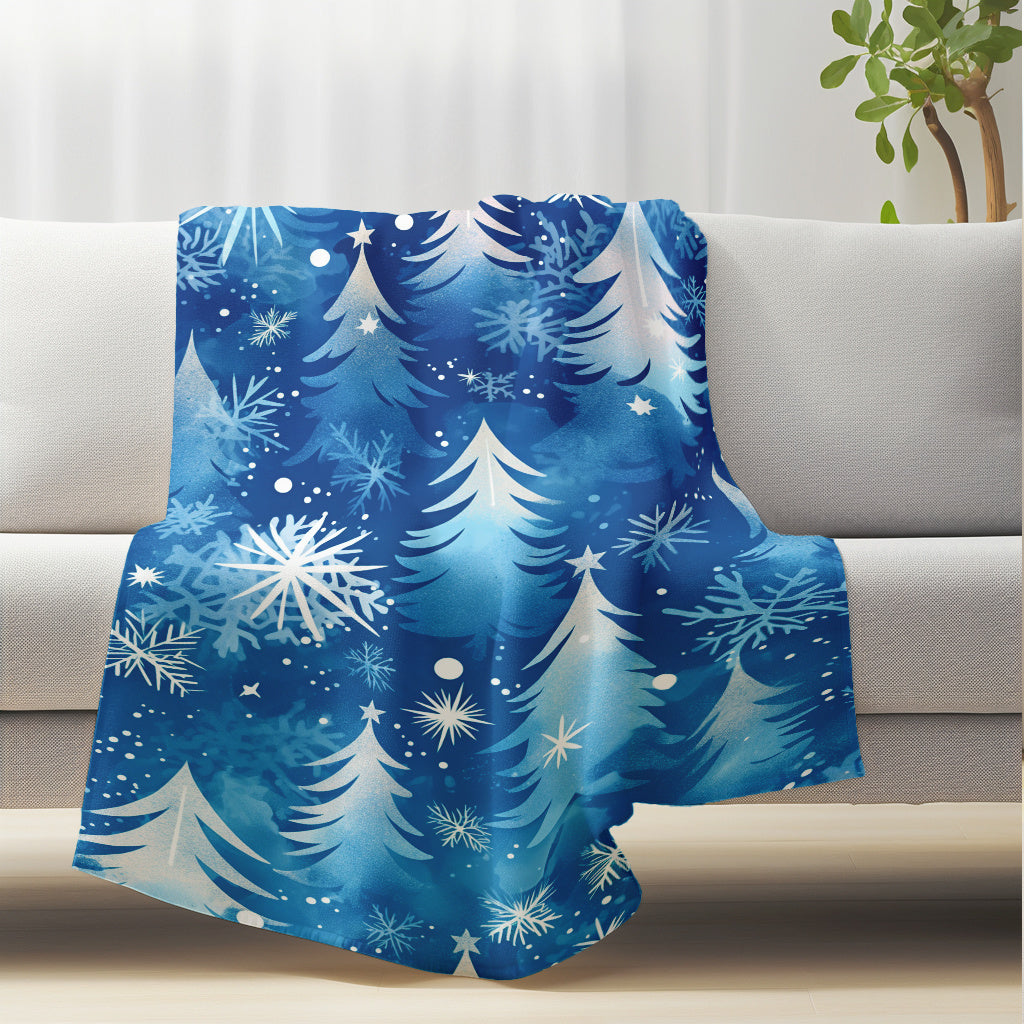 This modern blue snowflake and pine tree pattern flannel blanket is perfect for winter dreams. It's lightweight, plush, and comfortable, making it ideal for snuggling up on the sofa or taking a nap at the office. This versatile blanket is also great for