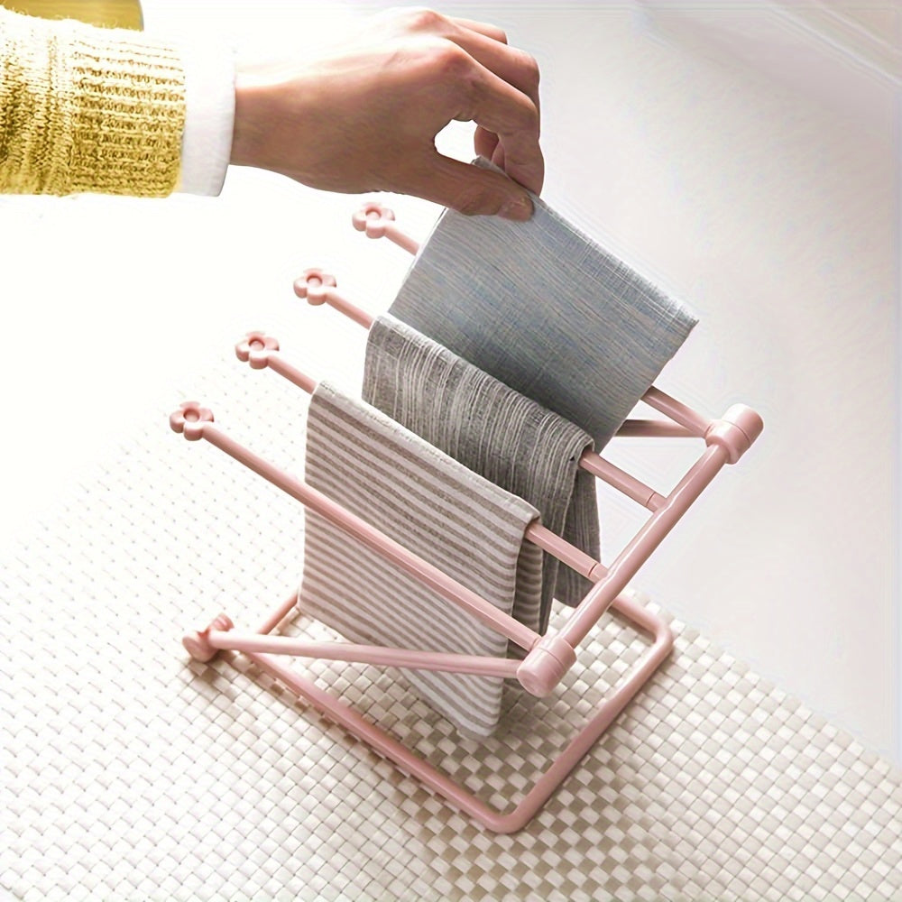 Foldable kitchen rag rack for drying dishcloths on the countertop, also functions as a towel bar rack and desktop waterlogging rag holder.