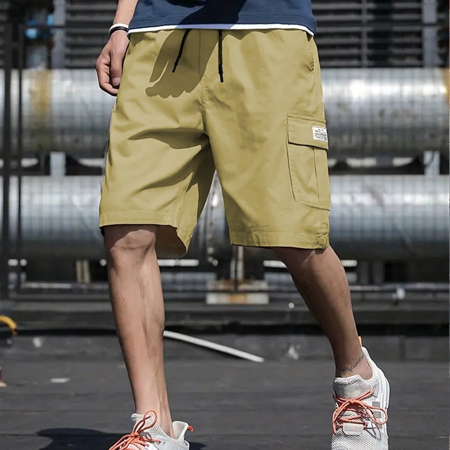 Men's plus-size cargo shorts made of lightweight polyester with pockets, drawstring waist, and suitable for basketball and streetwear.