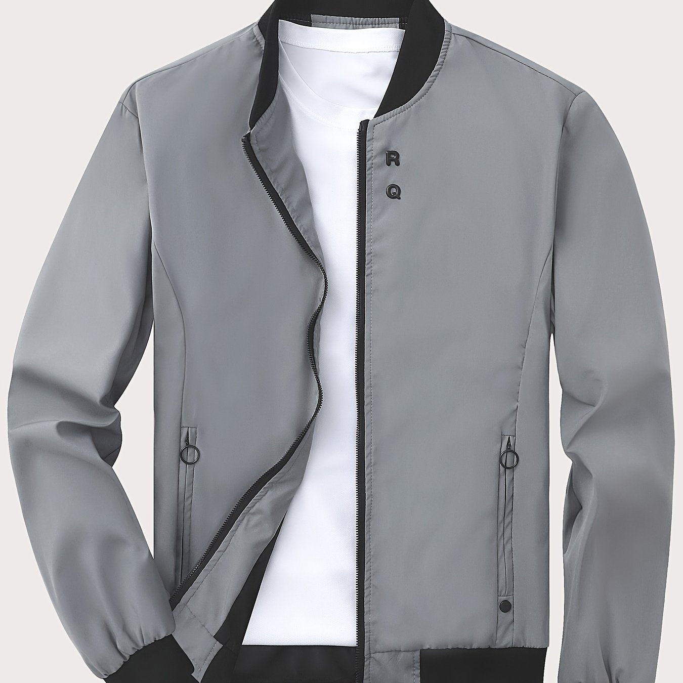 Solid color polyester jacket with zipper, stand collar, pockets, regular fit, and long sleeves. Suitable for all seasons with 100% polyester lining and 125g/m² fabric weight.