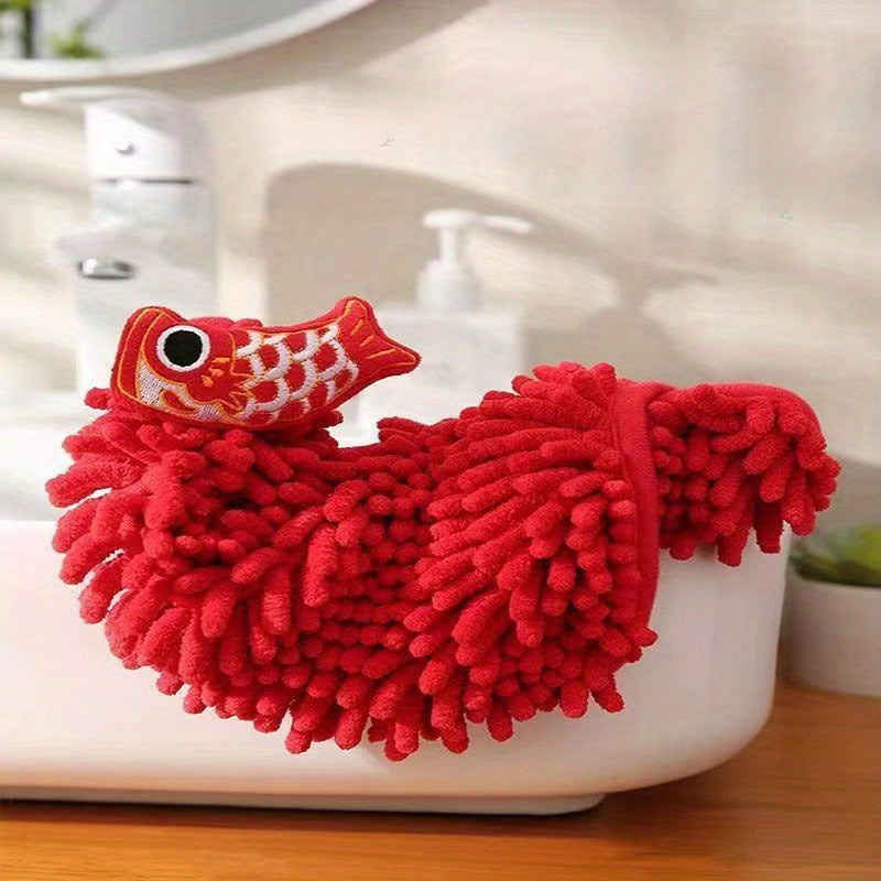 Red chenille hand towel for kitchen and bathroom décor with festive hanging design.