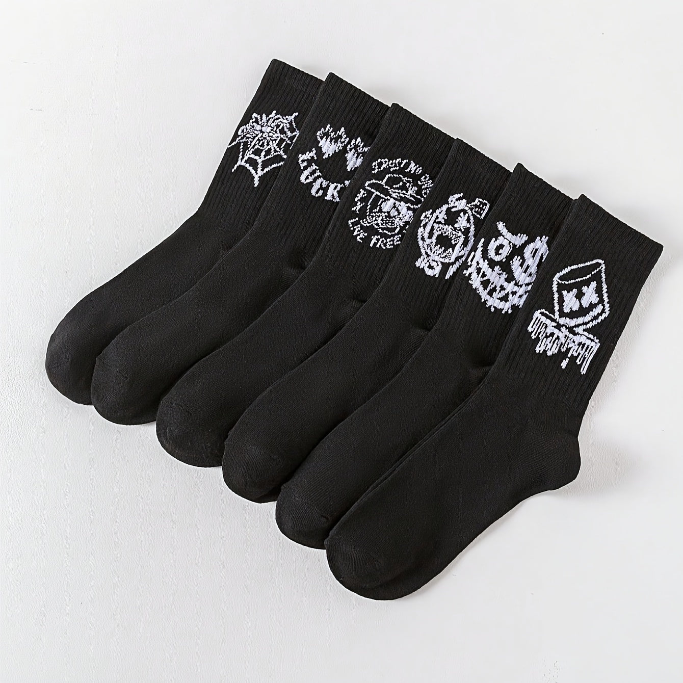 6/10 pairs of men's mid-calf socks with random black and white graffiti designs for all seasons.