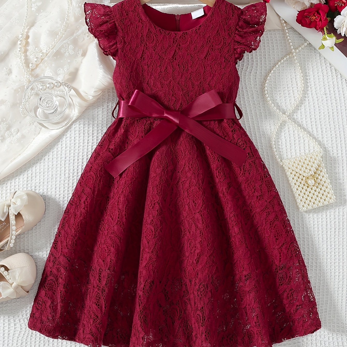 Girls' spring/summer dress with lace detail, belt, and flutter sleeves, ideal for daily wear or birthday parties.