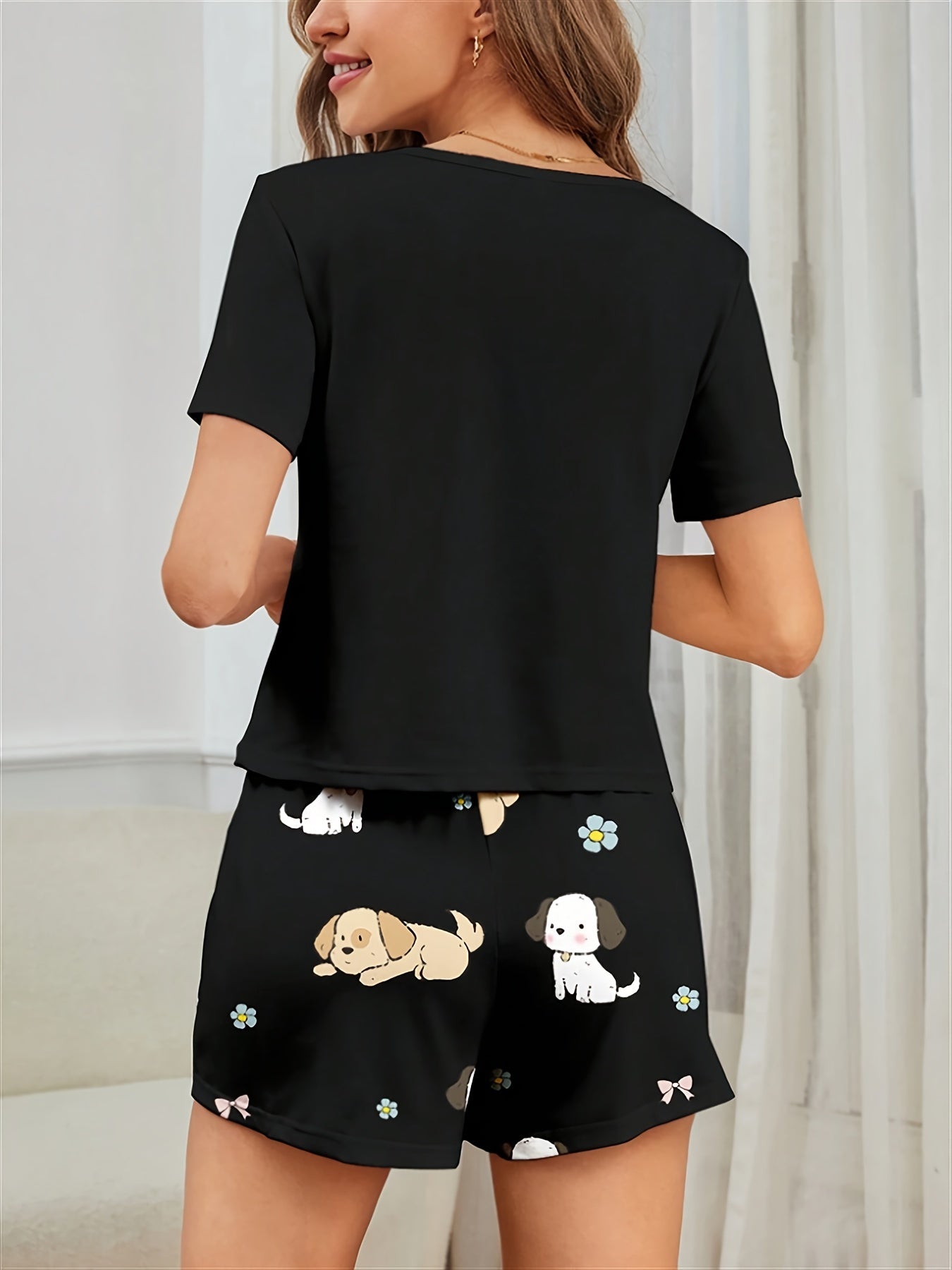 Women's Puppy Print Pajama Set. Cute cartoon design with short sleeve top and shorts for a comfortable fit.