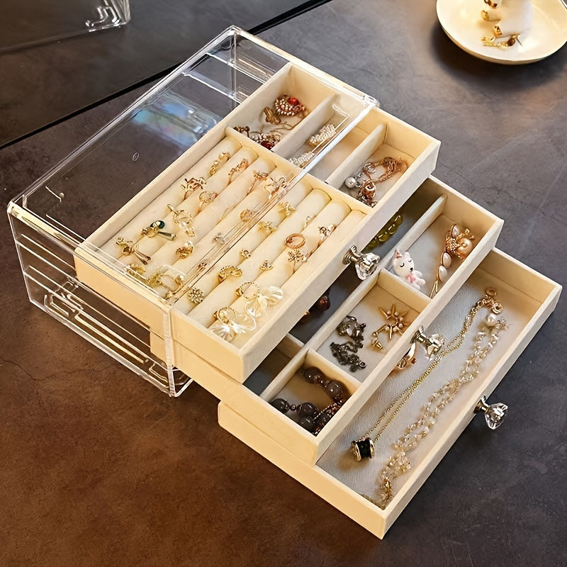 1 large drawer jewelry box with 3 layers for storing earrings, rings, necklaces, bracelets, and pendants on a desktop.