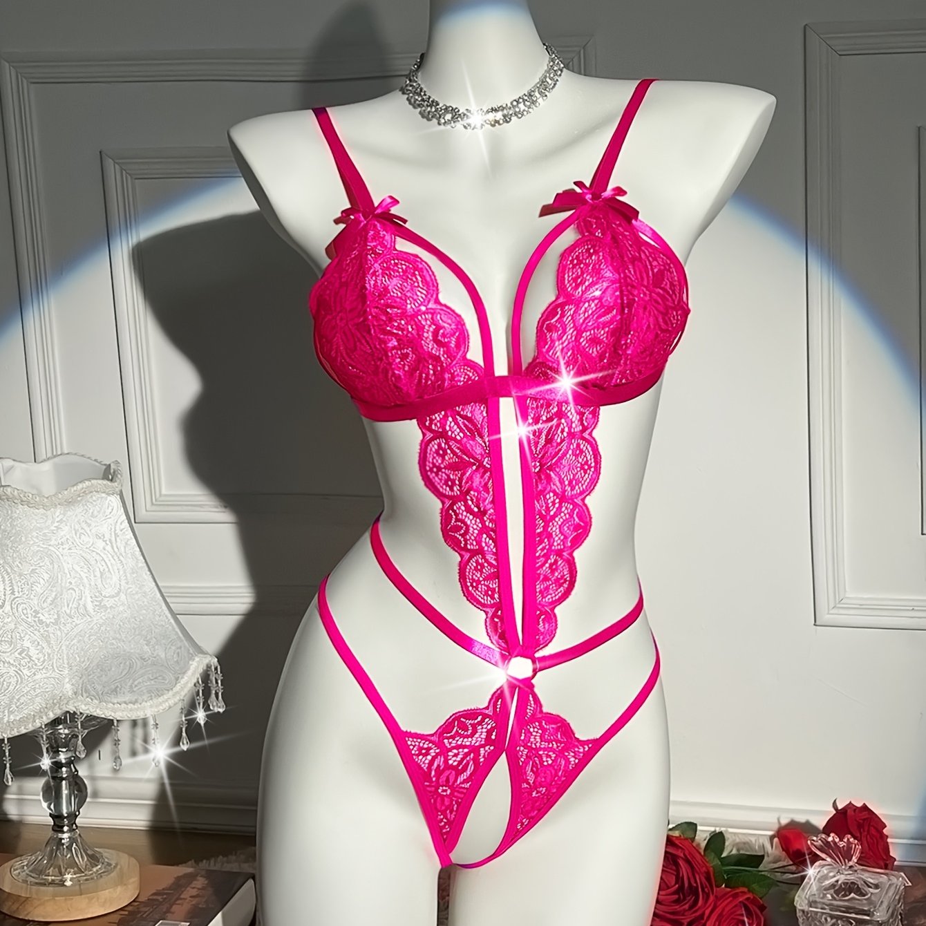 Flower lace teddy with open crotch and sexy bow bodysuit. Flirty lingerie for women.