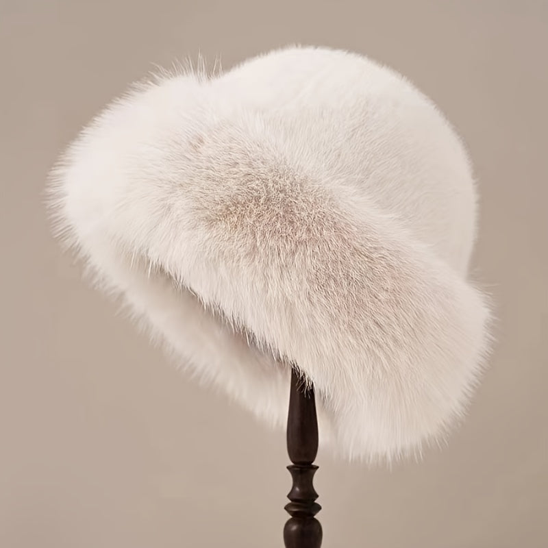 Stylish faux fur bucket hat for women with warm polyester lining.