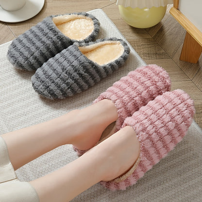 Women's striped print plush house slippers with anti-slip sole for indoor use.