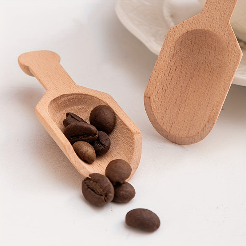 Set of two mini beech wood spoons, perfect for serving salt, tea, or coffee. Each spoon has a capacity of 6.5g/0.229oz. Ideal for gifting on special occasions like Christmas, Halloween, Valentine's Day, Father's Day, or Mother's Day.