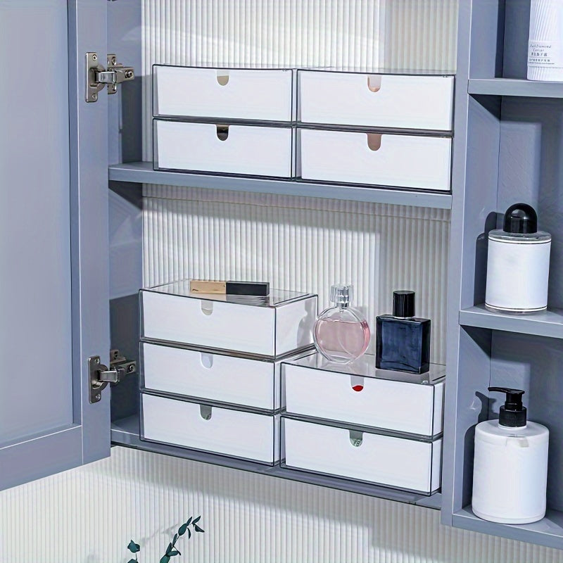 Cosmetics storage box with drawers, stackable design for bathroom and bedroom organization.